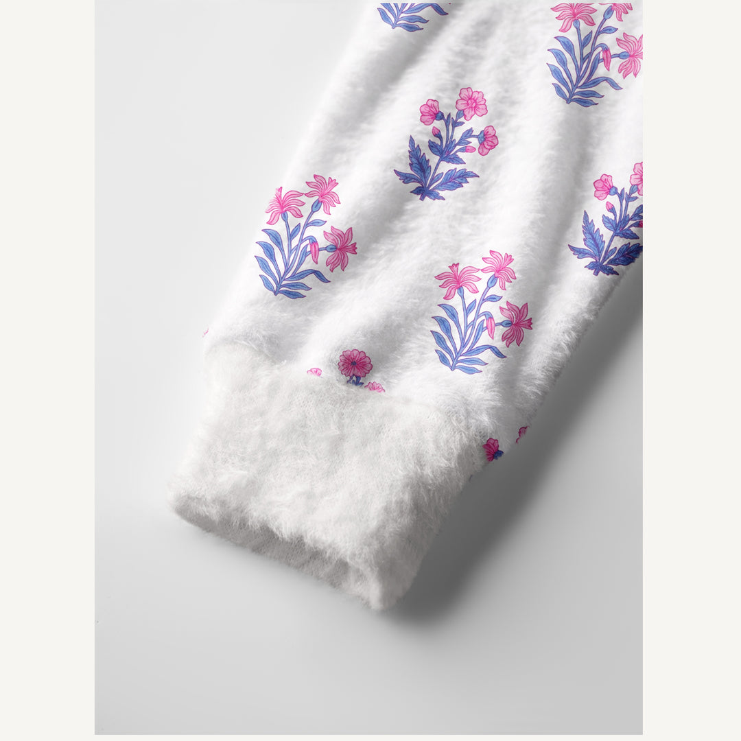 Cardigan lavorato a maglia con motivi botanici in delicate tonalità di rosa e blu