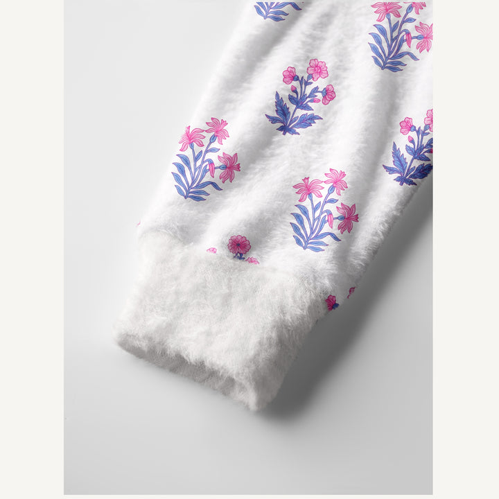 Cardigan lavorato a maglia con motivi botanici in delicate tonalità di rosa e blu