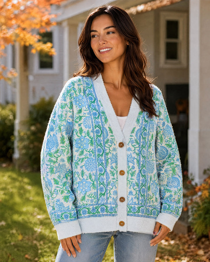 Cardigan lavorato a maglia con bordo decorato con un motivo botanico a vite blu