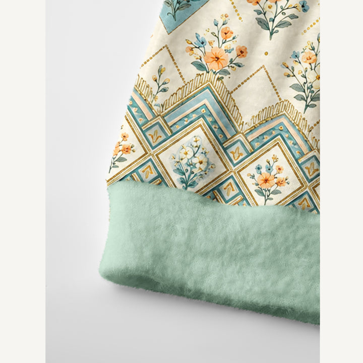 Cardigan lavorato a maglia in stile patchwork con motivi floreali in tonalità tenui