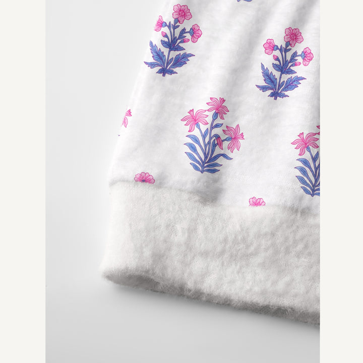 Cardigan lavorato a maglia con motivi botanici in delicate tonalità di rosa e blu