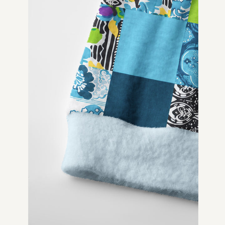 Cardigan lavorato a maglia in patchwork con motivi floreali geometrici