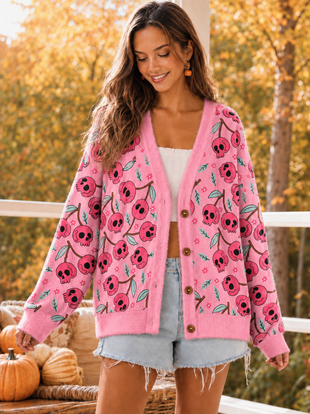 Cardigan lavorato a maglia a tema Halloween con motivo di teschi rosa e fiori