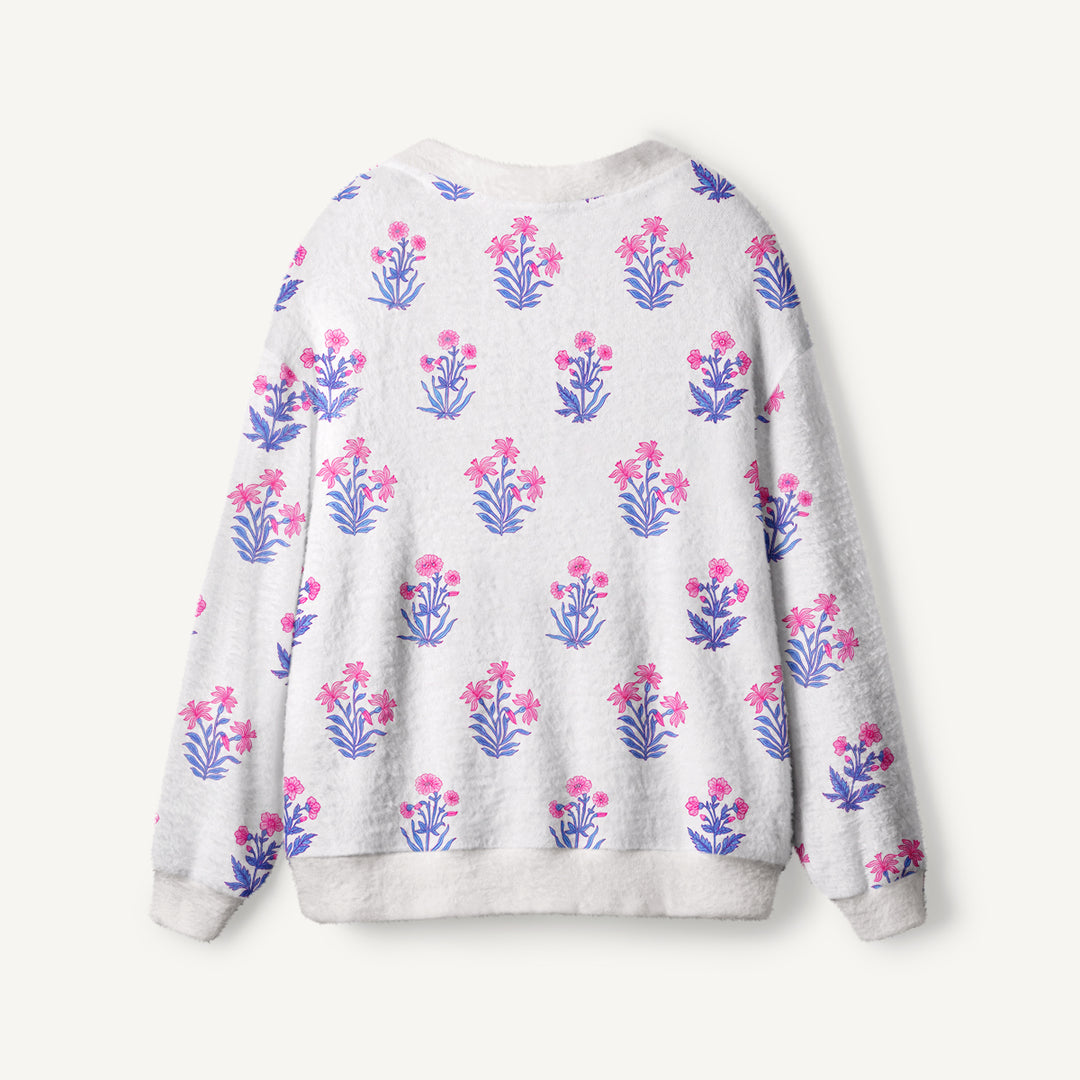 Cardigan lavorato a maglia con motivi botanici in delicate tonalità di rosa e blu