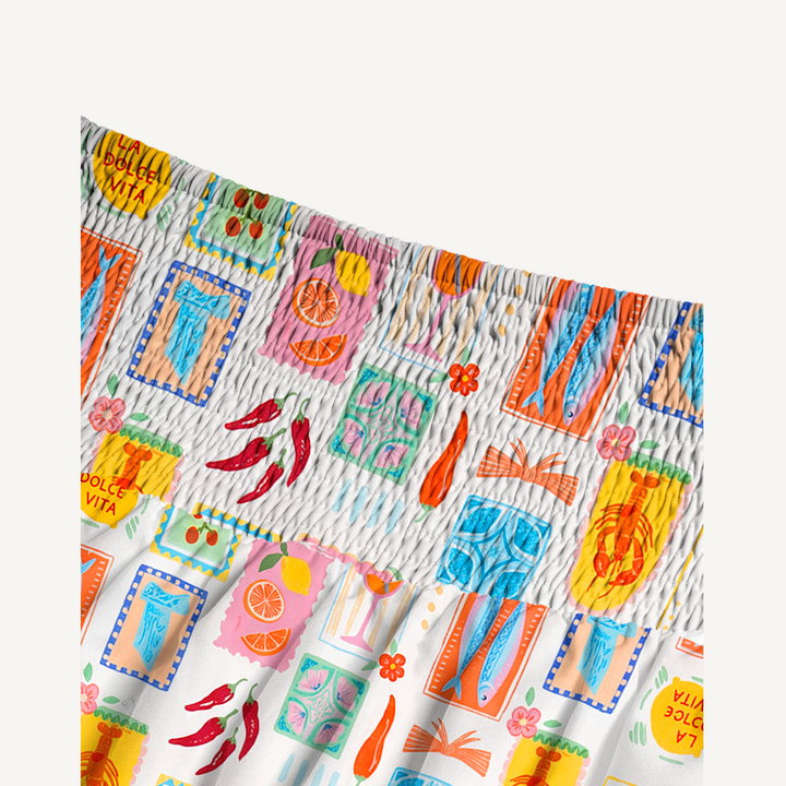 Gonna lunga con stampa tropicale e abito senza spalline