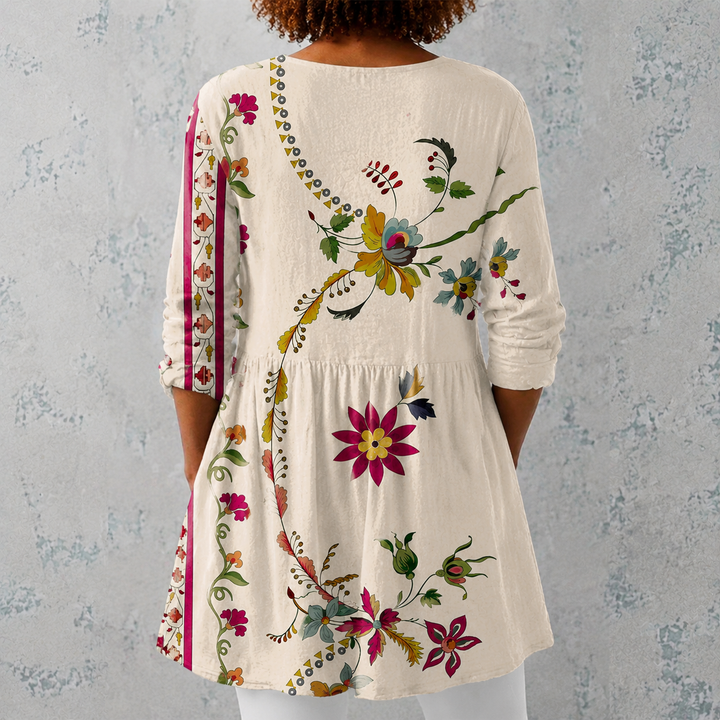 Irene | Blusa lunga in lino con motivo floreale folkloristico e orlo decorato