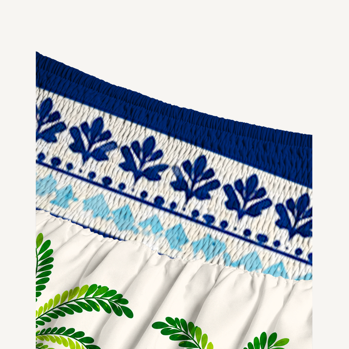 Gonna lunga e abito senza spalline dai vivaci motivi tropicali